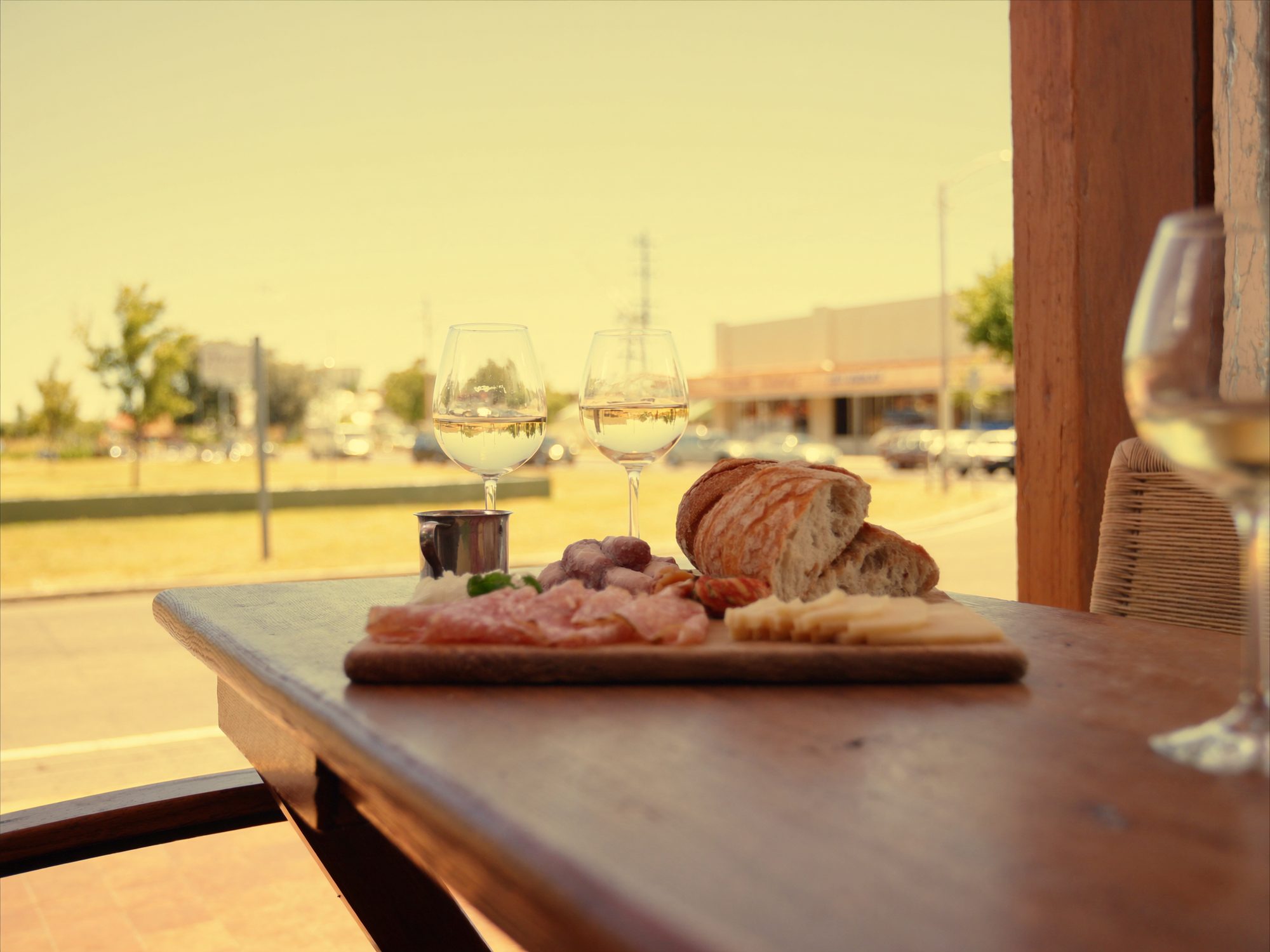 Alfresco lunch table with wine and a cheese board